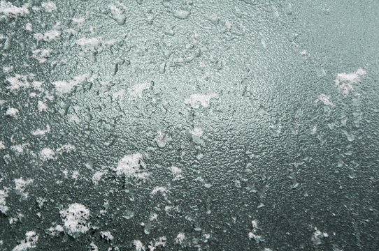 Ice Covered Car Window In Winter Time