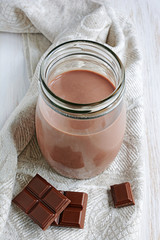 Chocolate milk with pieces of chocolate bar
