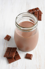 Chocolate milk with pieces of chocolate bar