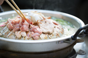  Grilling sliced pork and meat on hot pan asian style