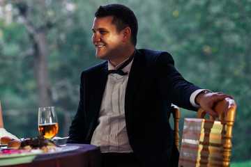 Happy smile of the groom on the wedding celebration