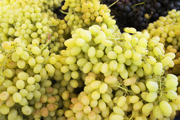 Grape. Wine grapes background.Green grapes. Grapes an market. It can be used as a food background (selective focus)