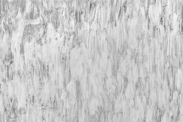 Grungy white brush paint background with grain.