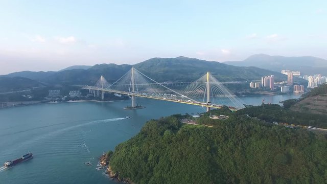 An aerial view fly over Kap Shui Mun Bridge under sunny day
