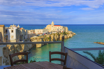 Summertime. Gargano coast: bay of Vieste.-(Apulia) ITALY-Panoramic view of the old city.
