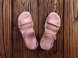 Child's sandals on a wood