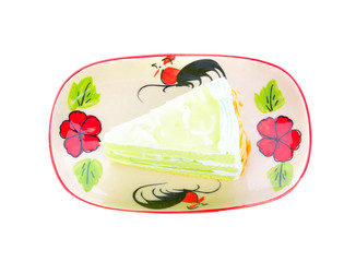 A piece of coconut cake on white background