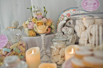 Fototapeta na wymiar beautiful roses and sweets are on the table