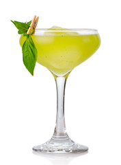 Green alcohol cocktail with basil garnish isolated