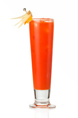 Orange alcohol cocktail with green garnish isolated