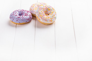 three donuts on a wooden background