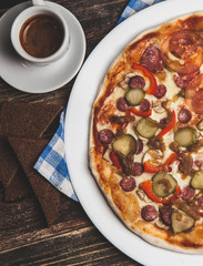 Delicious fresh pizza served on wooden table