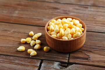 Sweet corns on a brown wooden table