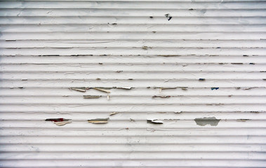 White painted metal stripes background grunge texture with old paint flakes off over time