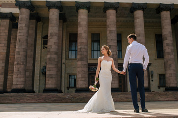 Building with the columns and newlyweds