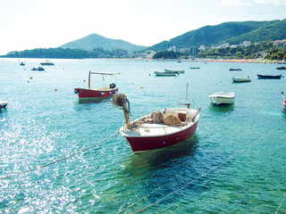 Many small fishing boats, summer Sunny day, clean water