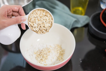 Baking vegan muffin - Woman's hand adding Ingredients