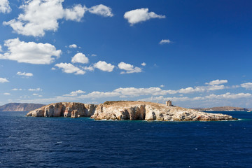 Fototapeta na wymiar Small uninhabited island of Ag. Efstathios and Milos island in the distance.