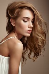 Fototapeta premium Portrait of young beautiful girl with blonde hair.