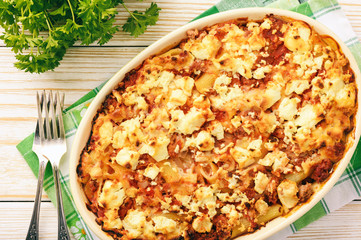 Pastitsio -greek casserole with pasta, meat, tomatoes and feta cheese.