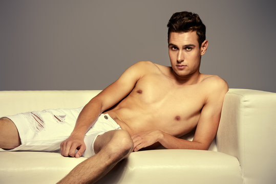 Fototapeta male on a couch