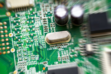 green circuit board representative of the high tech industry and computer science, top view, radial...