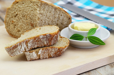 Slices of rustic bread on wooden board
