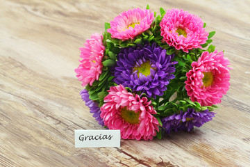 Gracias (thank you in Spanish) with colorful flower bouquet
