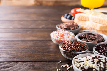Assorted dutch hagelslag sprinkles. Netherlands traditional sweets for breakfast. Copy space.