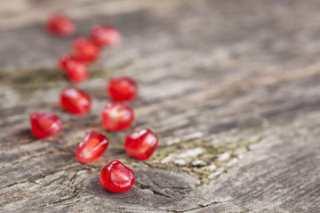 Pomegranate fruit on wooden vintage background.