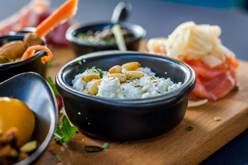 Food plateau to share in a restaurant with bread and sausages and ham