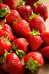 Fresh and sweet strawberries on a rustic wooden background