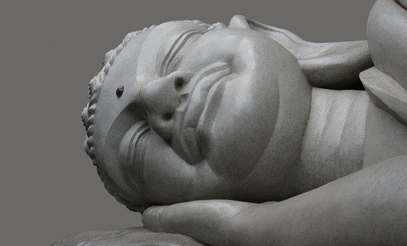 Sleeping Buddha on a black background.