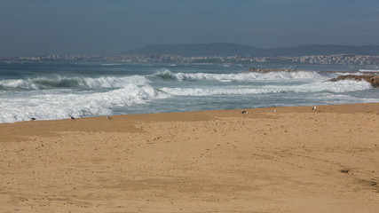 Atlantic coast in Costa de Caparica. Autumn day in Almada, Portugal.