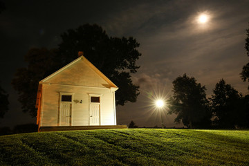 Chapel on hill in moonlight