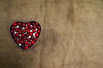 Cherries in a container in the shape of a heart
