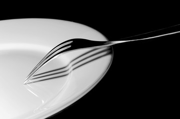 A Beautiful Fork On White Plate