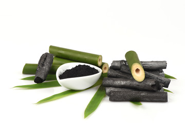 Bamboo charcoal burner and bamboo fresh in the basket and Bamboo charcoal powder. Woman.