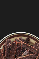 brownie stick with black background