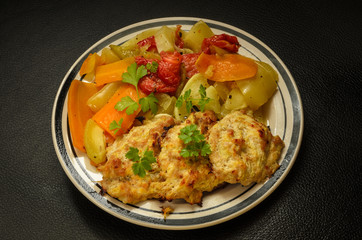 Breakfast of boiled vegetables and chicken cutlets