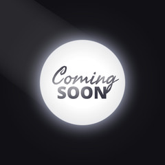 coming soon text with light focus
