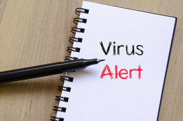 Virus alert text concept on notebook