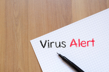 Virus alert text concept on notebook