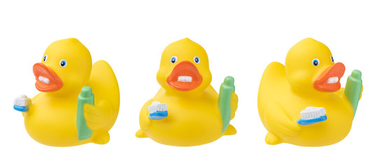Set of rubber duck with toothpaste toothbrush. Isolated on white