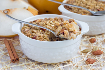 Baked oatmeal with nuts, almond milk, spices and asian pear