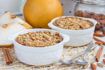 Baked oatmeal with nuts, almond milk, spices and asian pear