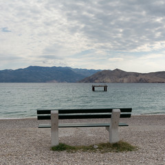 empty bench on the beach , Baska ,island Krk, Croatia