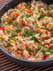 Couscous with vegetables and mushrooms. Vertical shot