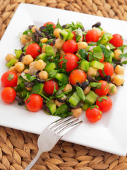Salad with tomatoes, cucumbers and chickpeas.