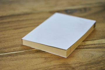 Fototapeta premium white book on wood texture